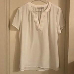 White blouse with pleated notch neckline
